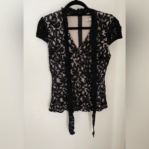 Black lace blouse with neck tie.